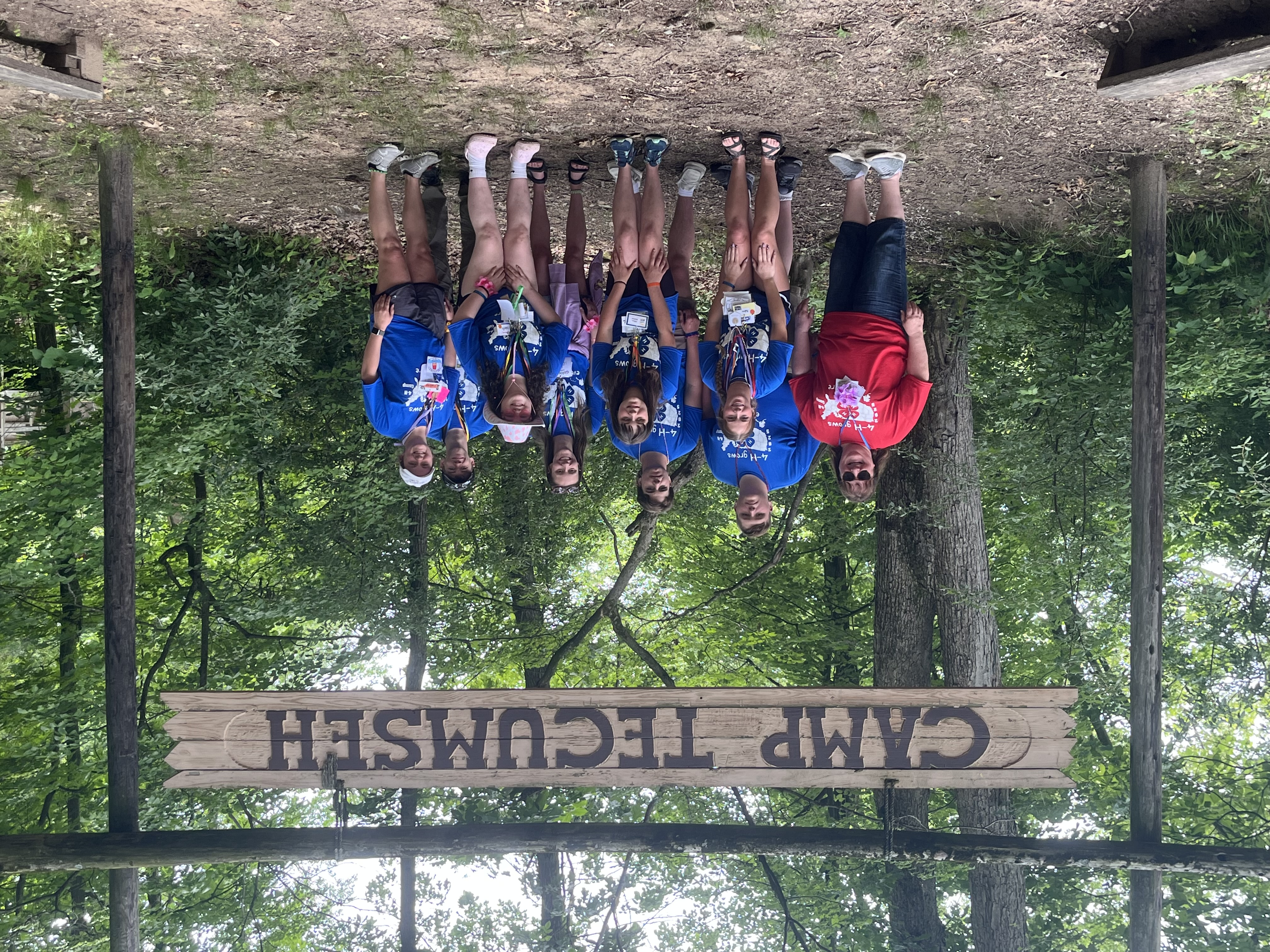 group of people under sign