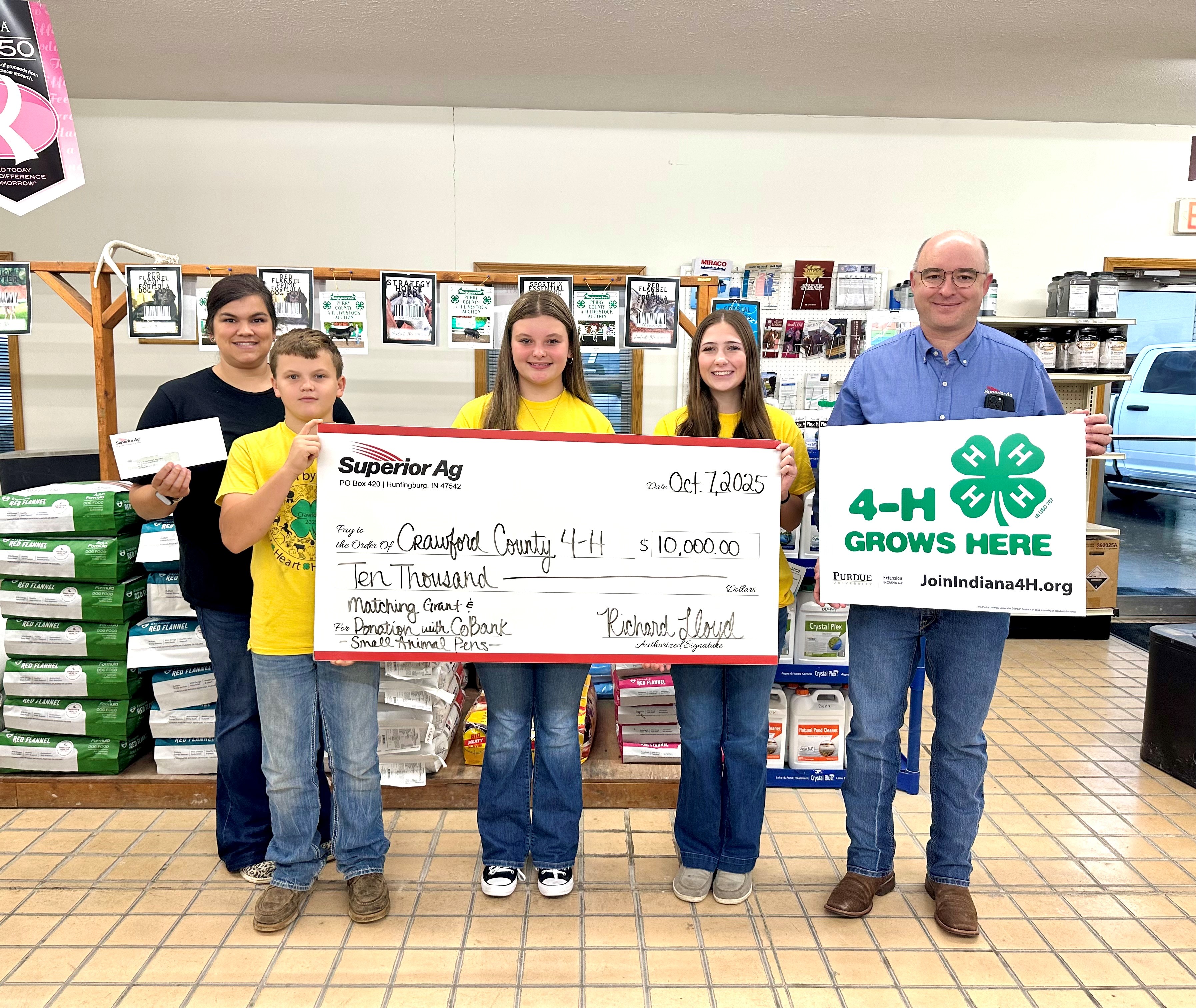 Crawford County 4-H members & Educator receiving donation check from Superior Ag.