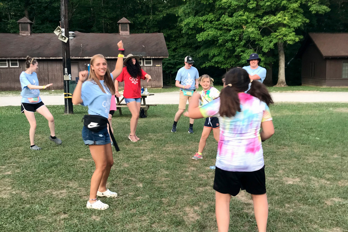 Group of Youth Dancing in a field at 4-H Camp