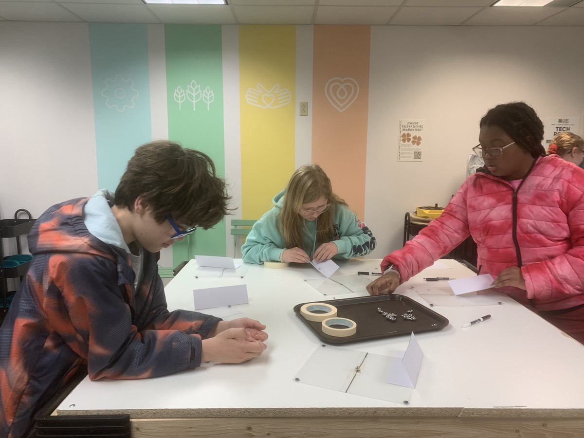 three Kids making crafts in 4-H Studio