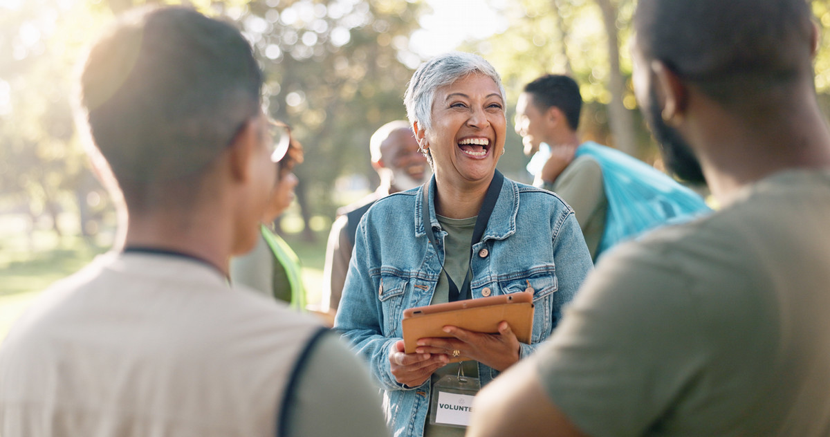 Photo of Smiling Community Worker with iPad in hand