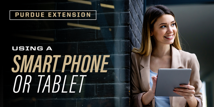 Woman standing holding a smart phone