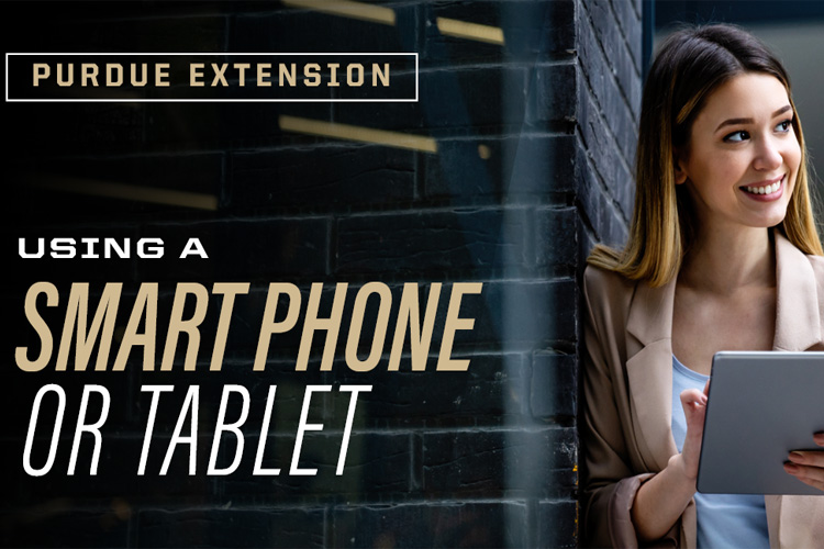 Woman standing holding a smart phone