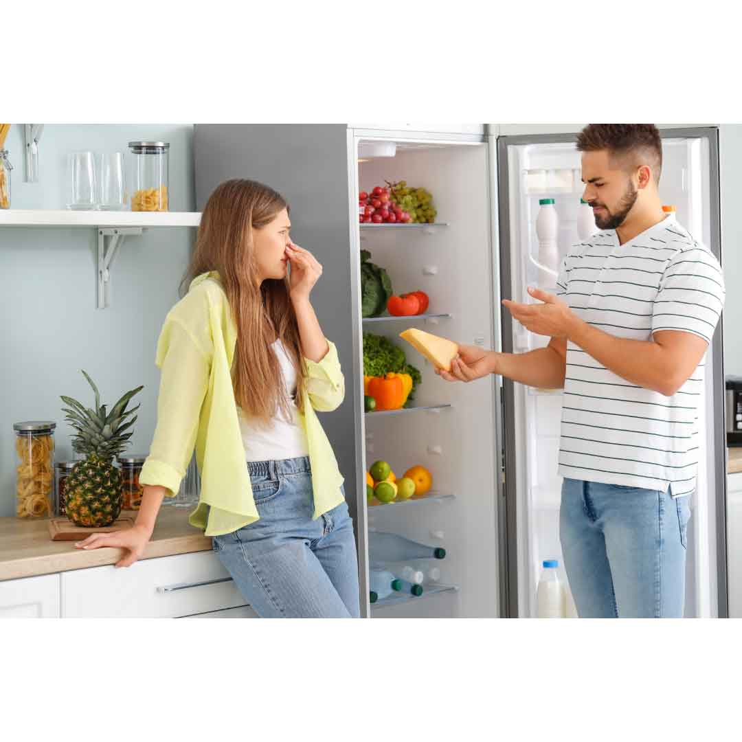 People smelling a fridge 