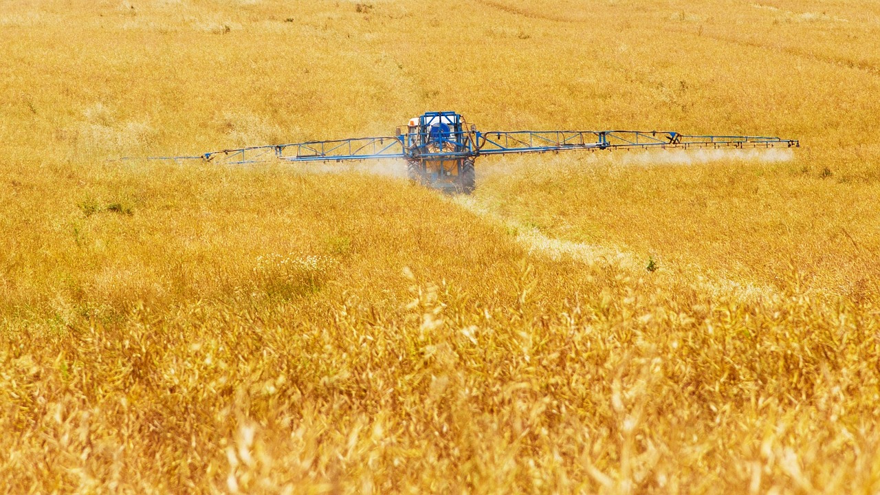spraying chemical in field