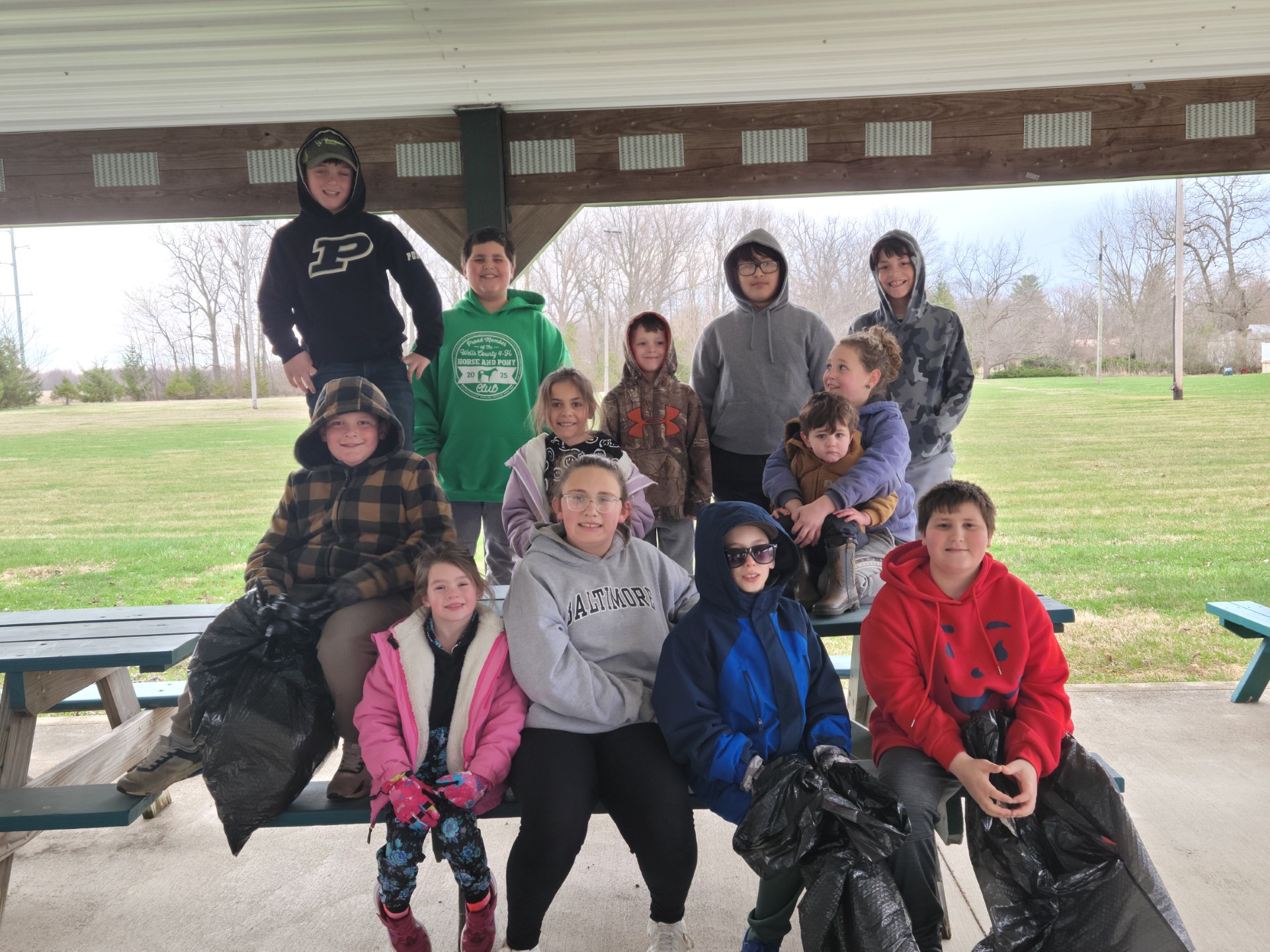 Group of 13 4-H Members pose at Park after their community service project.
