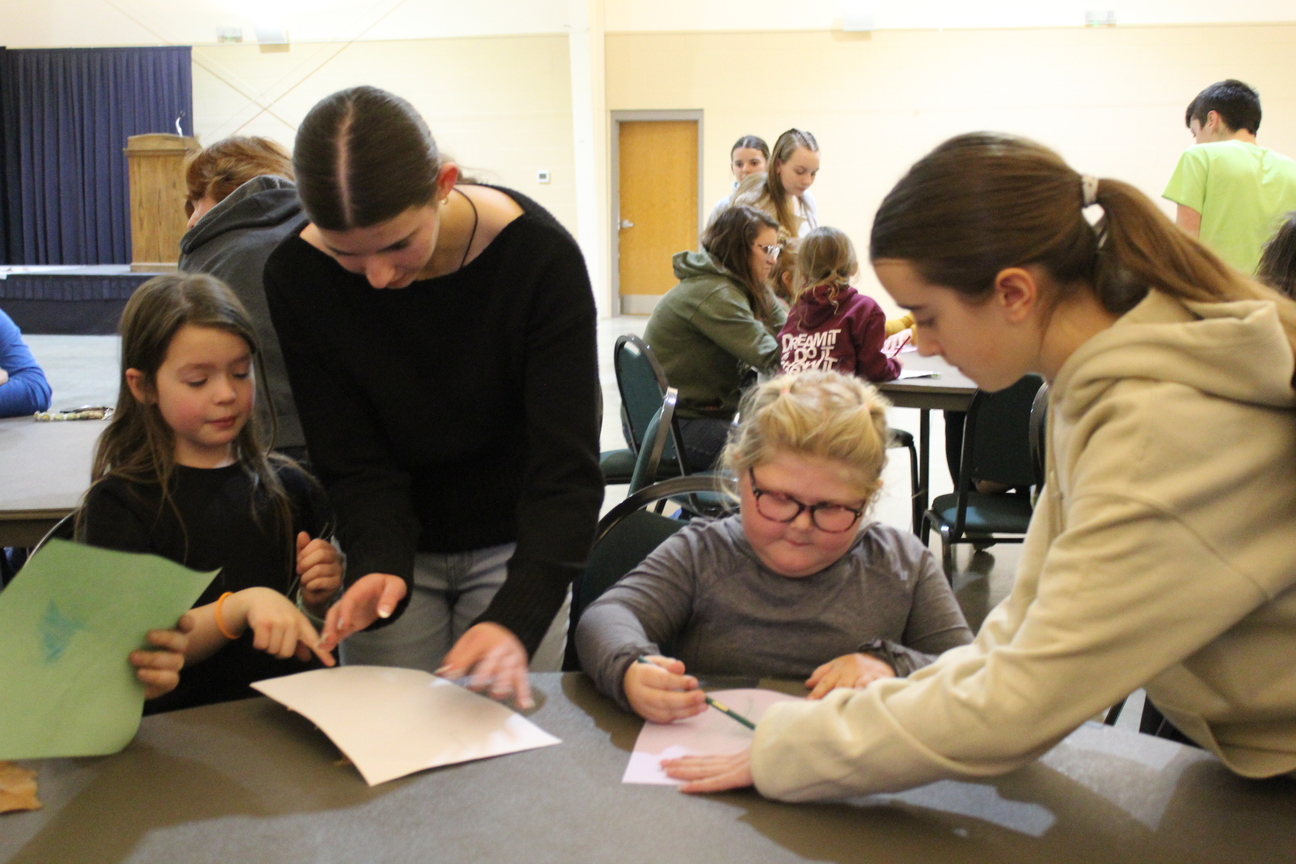 Junior Leaders help Mini 4-H Members with their Forestry Projects. 