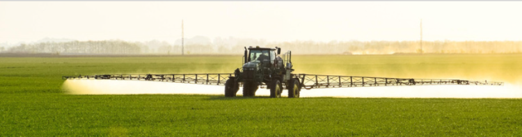 Equipment spraying crops