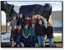 pictures of kids in front of dairy cow