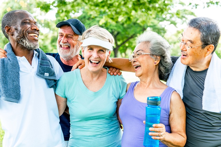 Image of a group of people after a walk talking and smiling