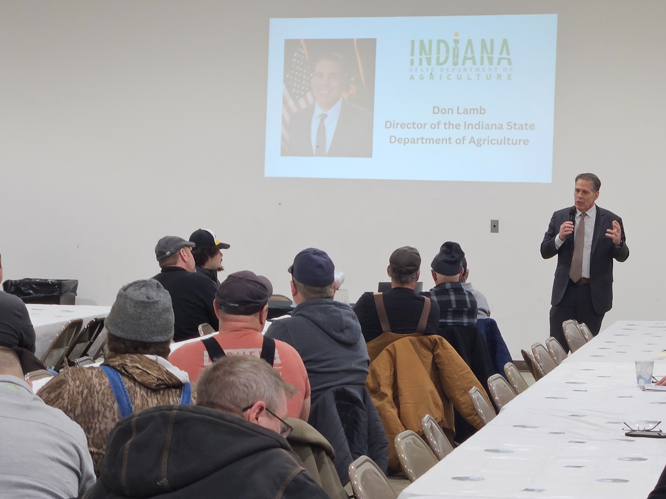 Don Lamb speaking to a room full of people. 