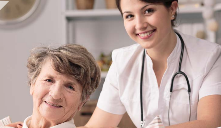 health provider pushing a person in a wheelchair 