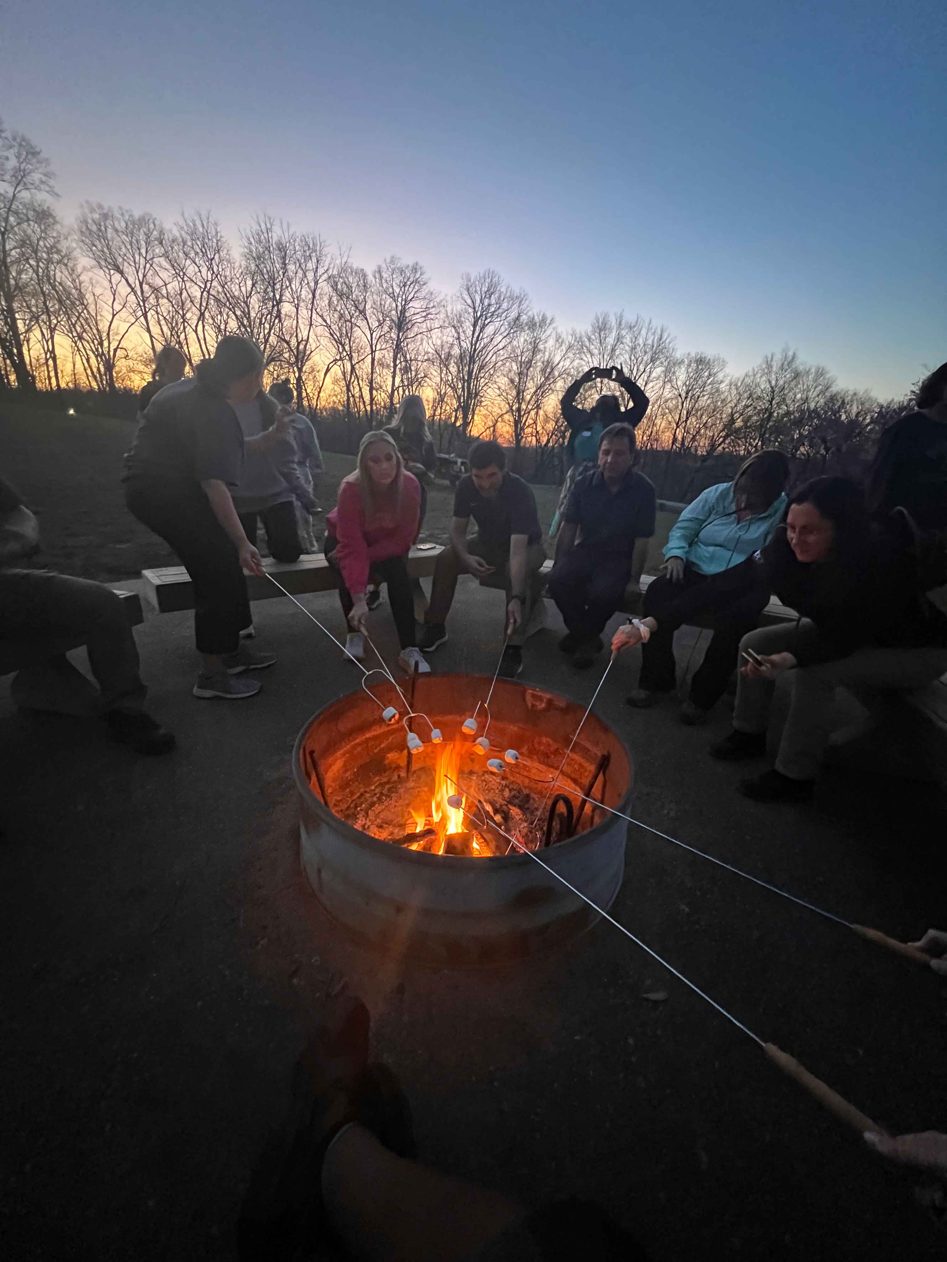 making smores around campfire