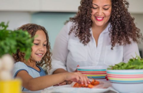 Women cooking with her child
