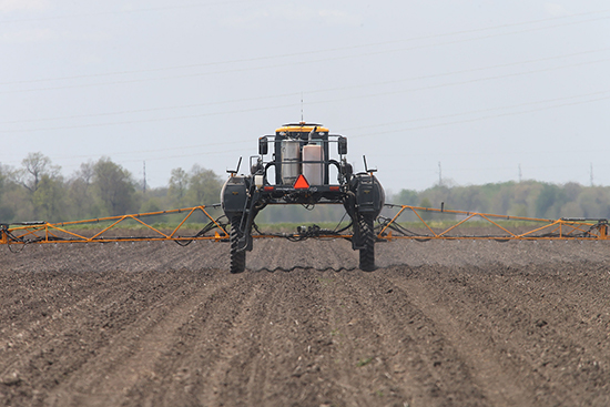 Sprayer boom in action applying ag chemicals.