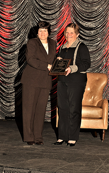 Karen Plaut, the Glenn W. Sample Dean of Purdue College of Agriculture, left, presents Extension educator Karen Richey with the 2021 Frederick L. Hovde Award of Excellence in Educational Service. (Purdue University photo)