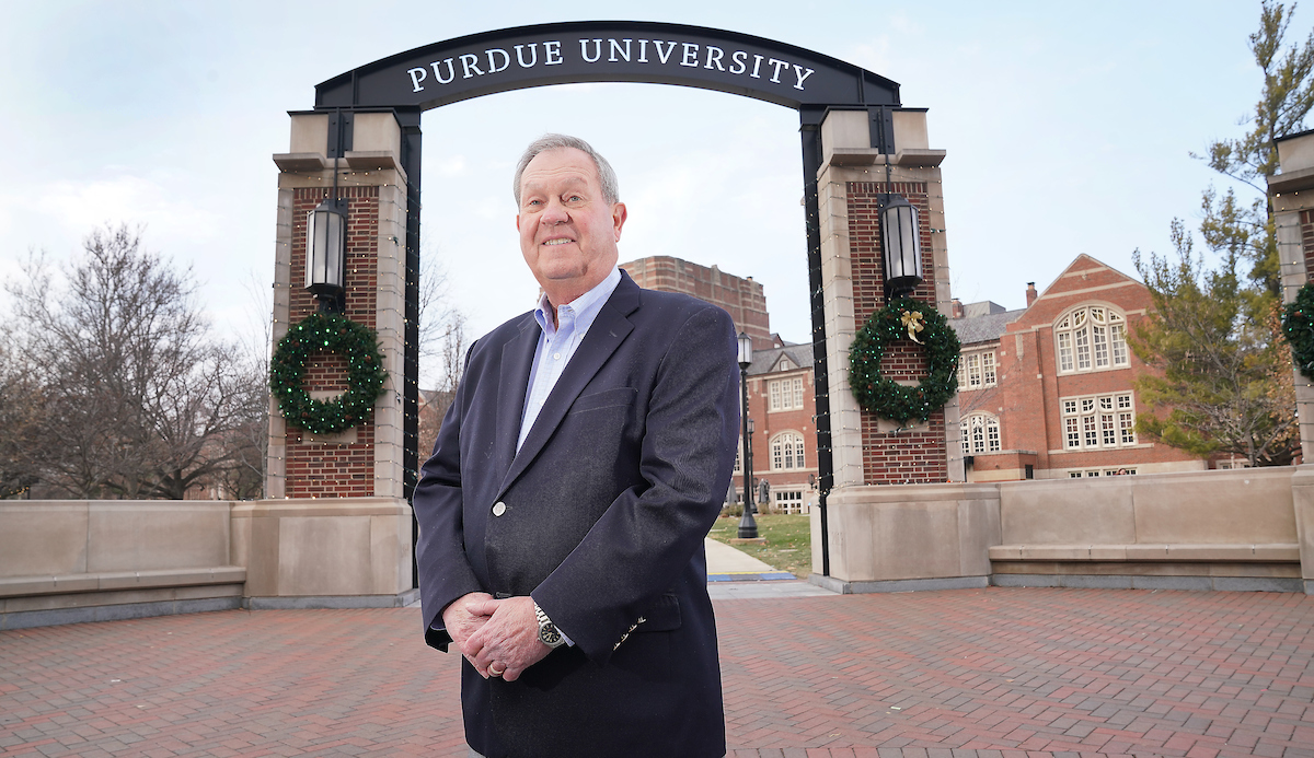 John Baugh stands in front of Purdue University