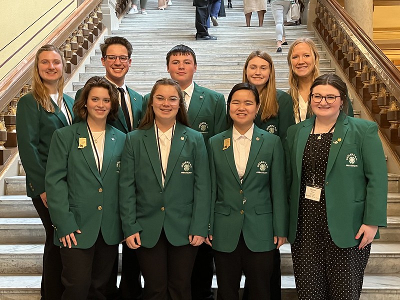 Indiana 4-H ambassadors in green jackets at Indiana Statehouse. 