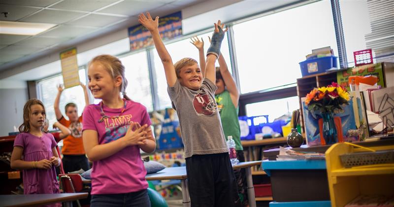 Children celebrate in a classroom