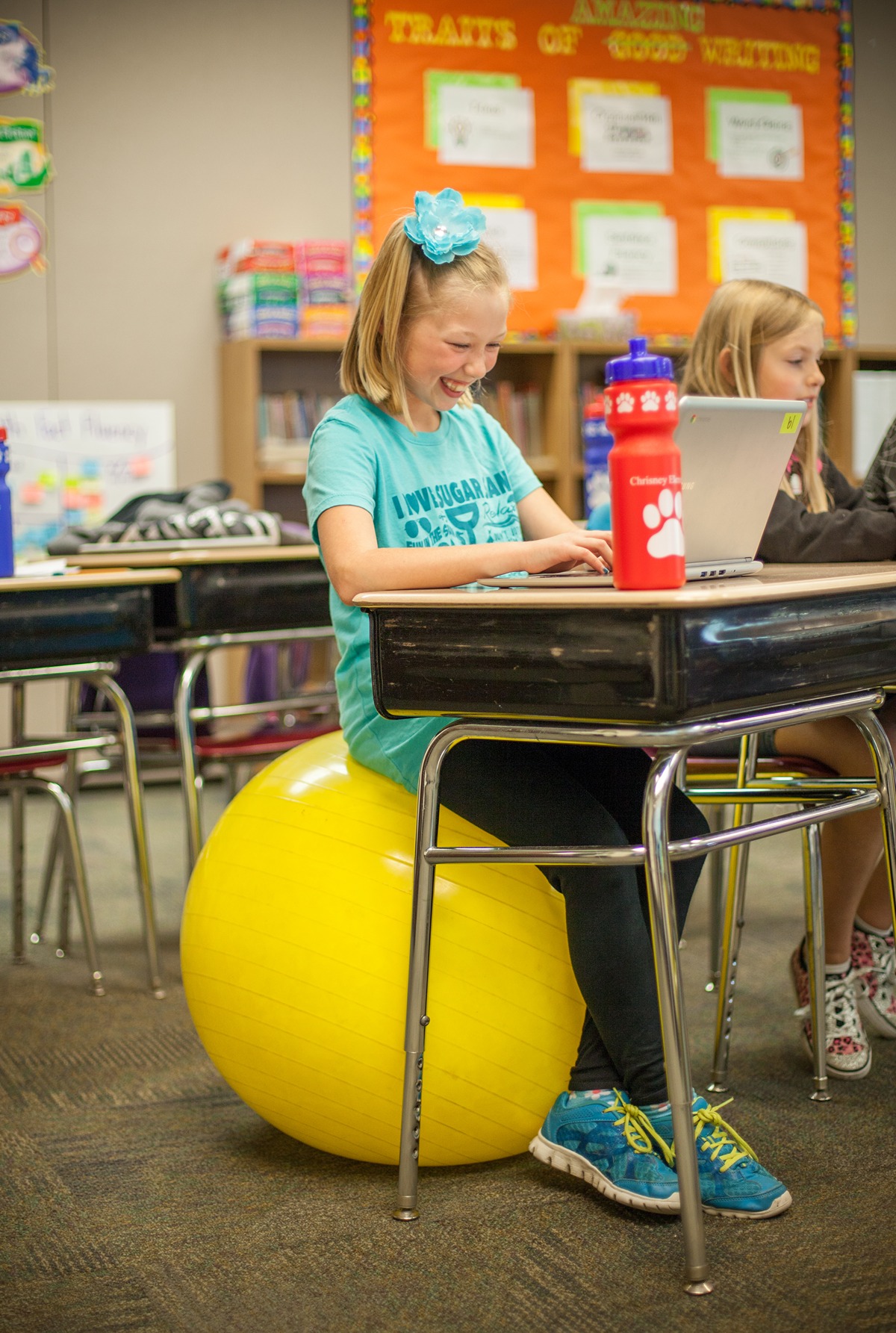A child sits on an exercise ball