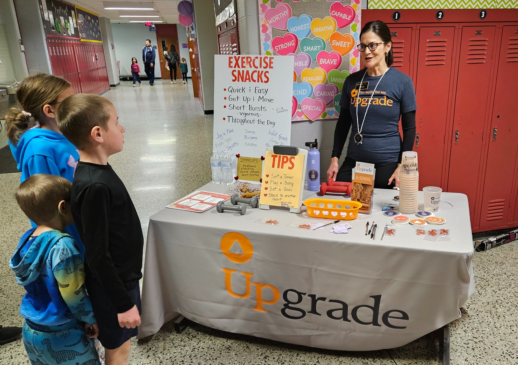 An Extension educator talks with students