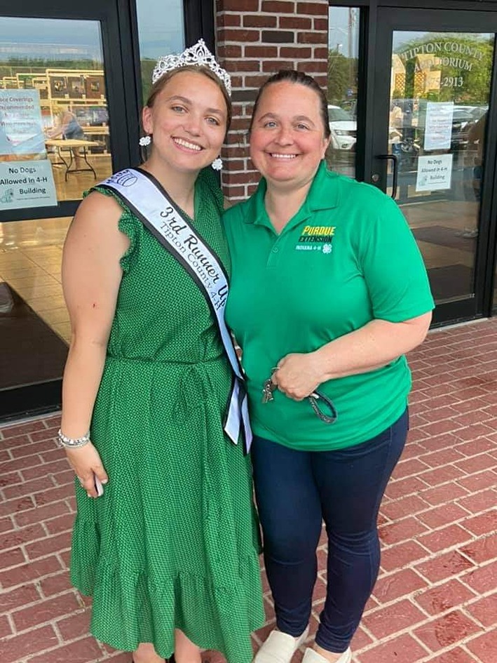 Maddie Powell, left, poses in a green dress and "Tipton County Fair 4-H runner up" sash with her mom, Shelly Powell, right.
