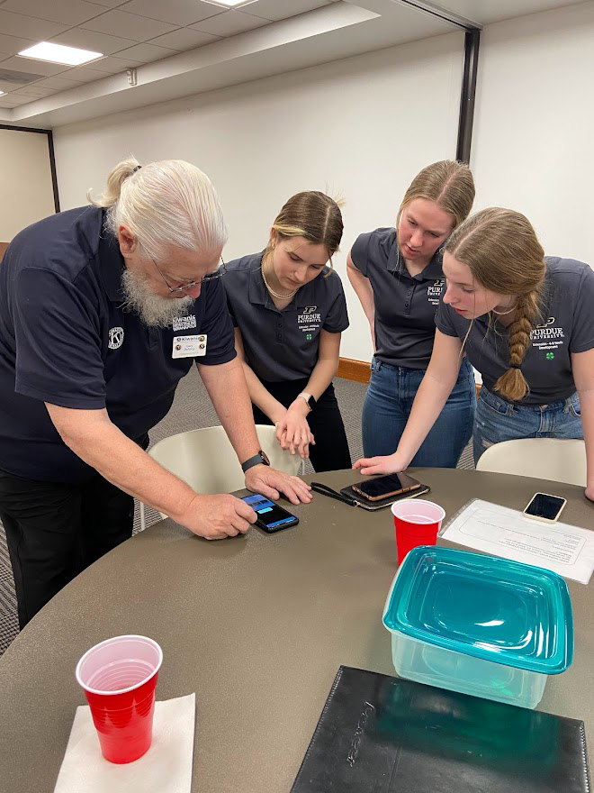 tech changemakers working on a phone