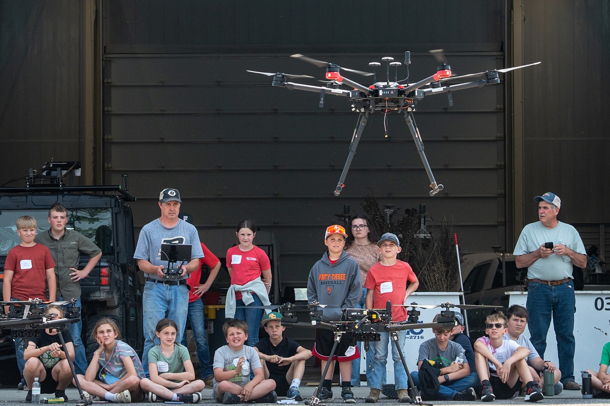 Youth learn about the science and technology behind drone flight. (Joshua Clark)