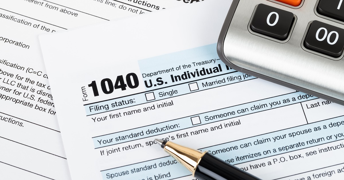 Tax preparation, W-2 forms and a calculator