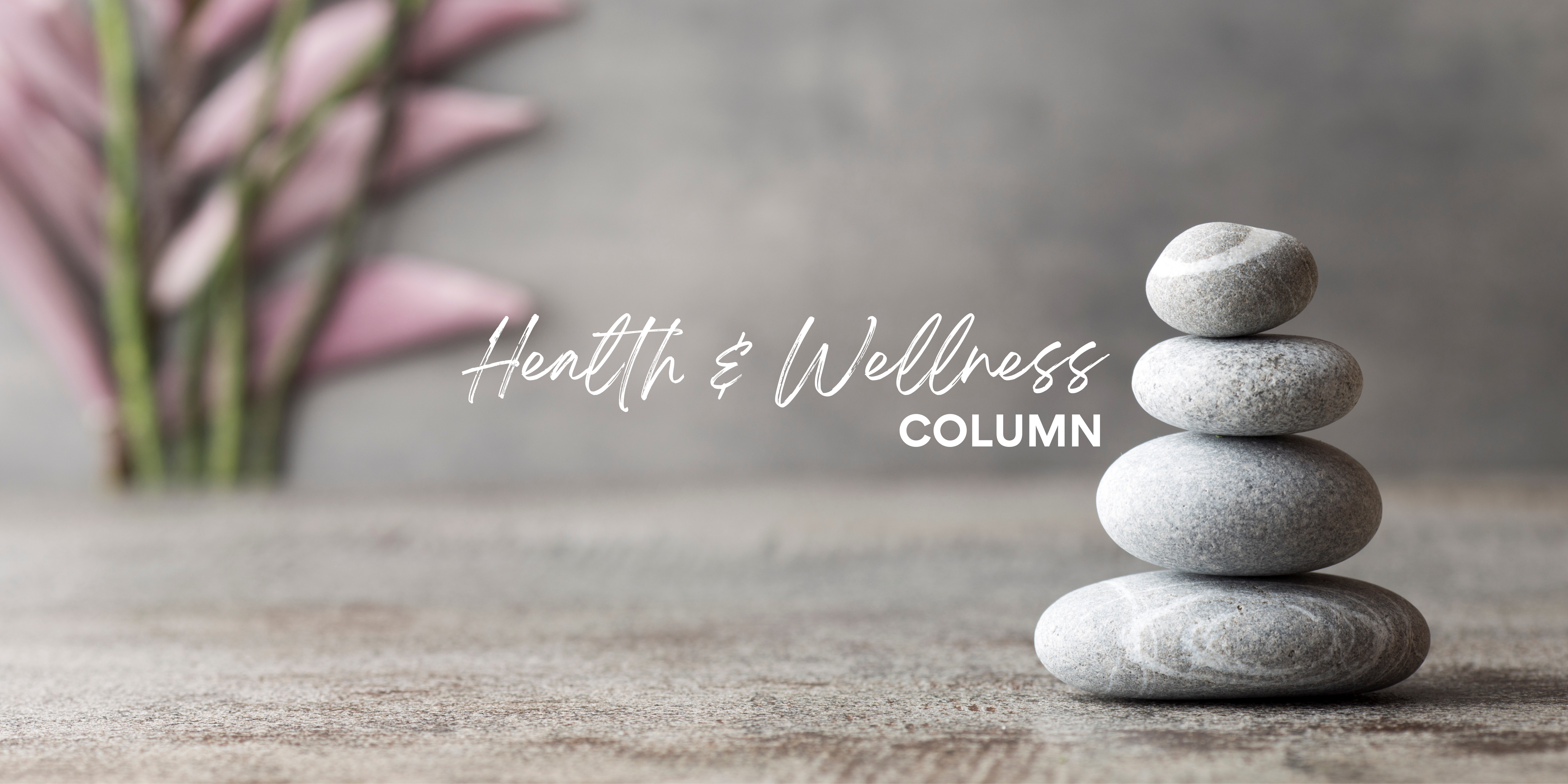 Health and Wellness Column text with relaxing rocks and flower