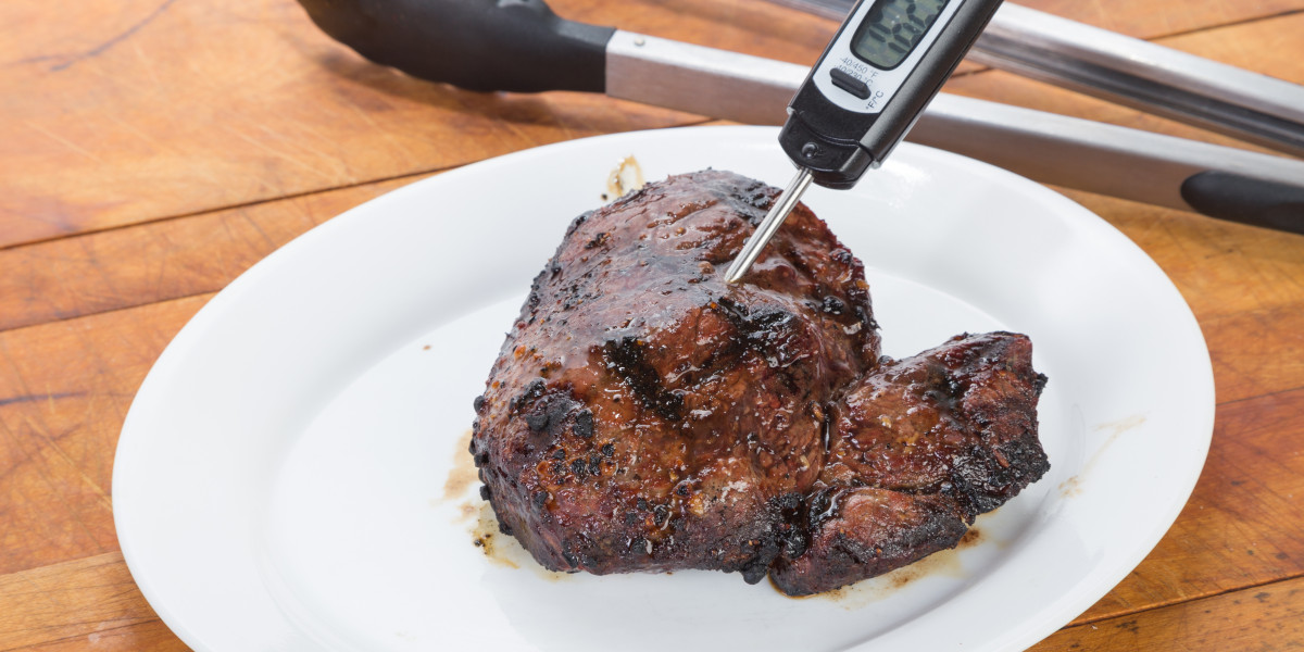 food thermometer in piece of steak