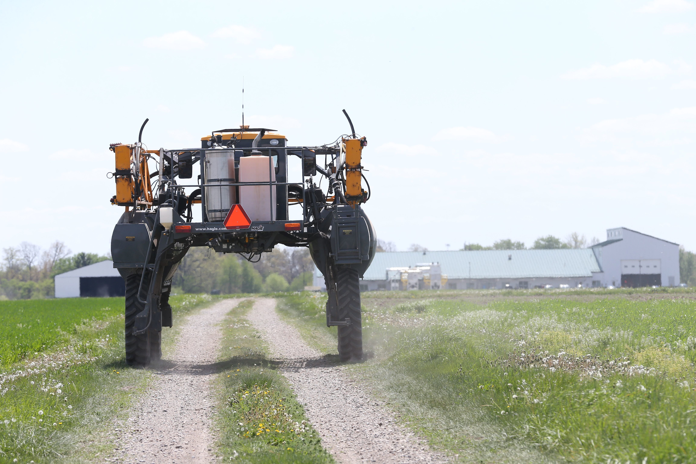 Agricultural spray rig heading to a field