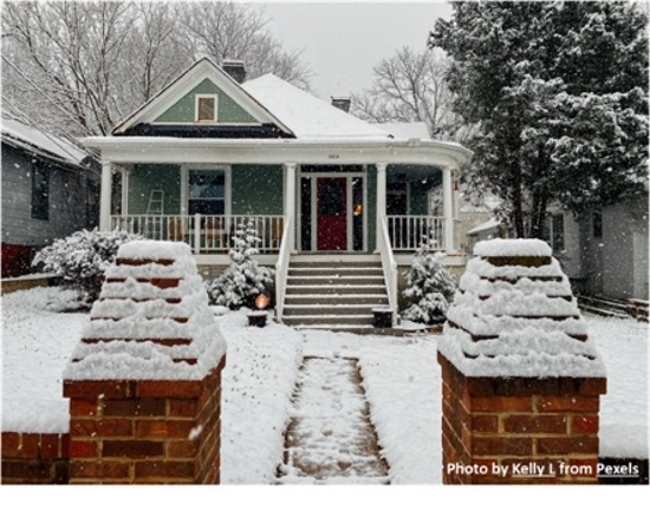 Image of a small house in winter with snow