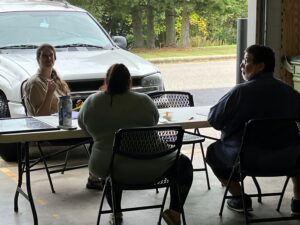 teacher and students at a table