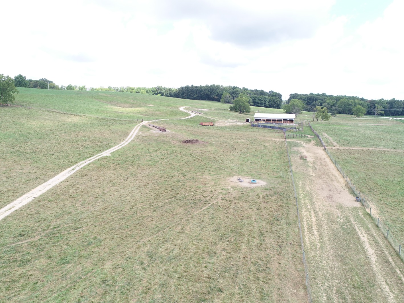 uav drone base station and barn with water station in grazing area