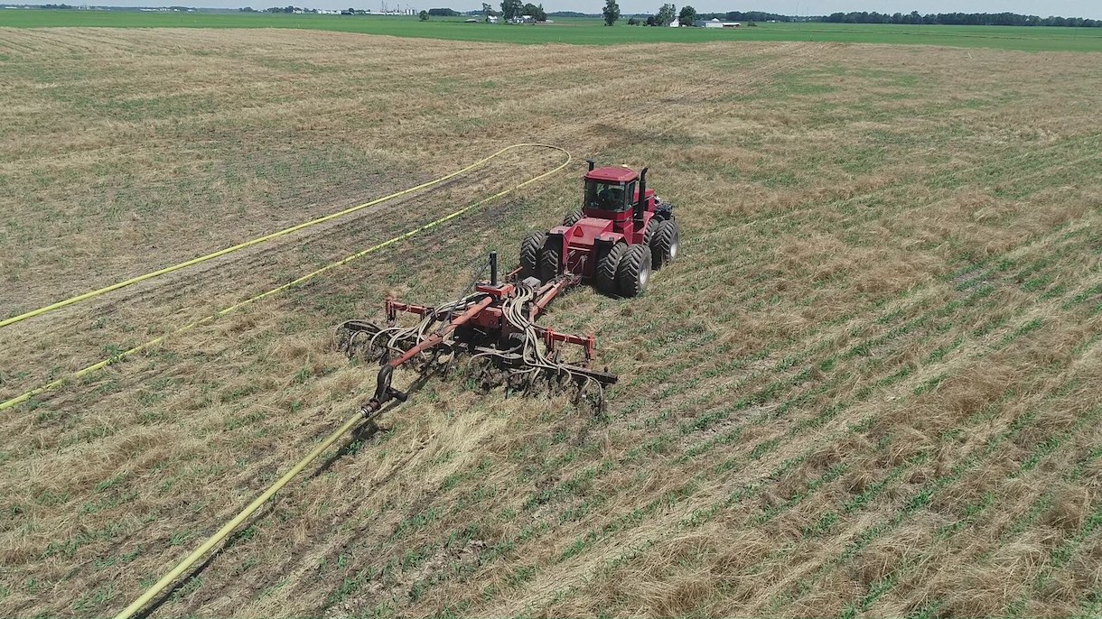 Image of tractor working field