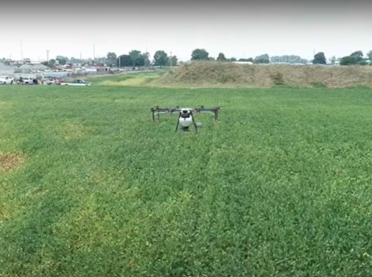 Image of a drone spreading crops